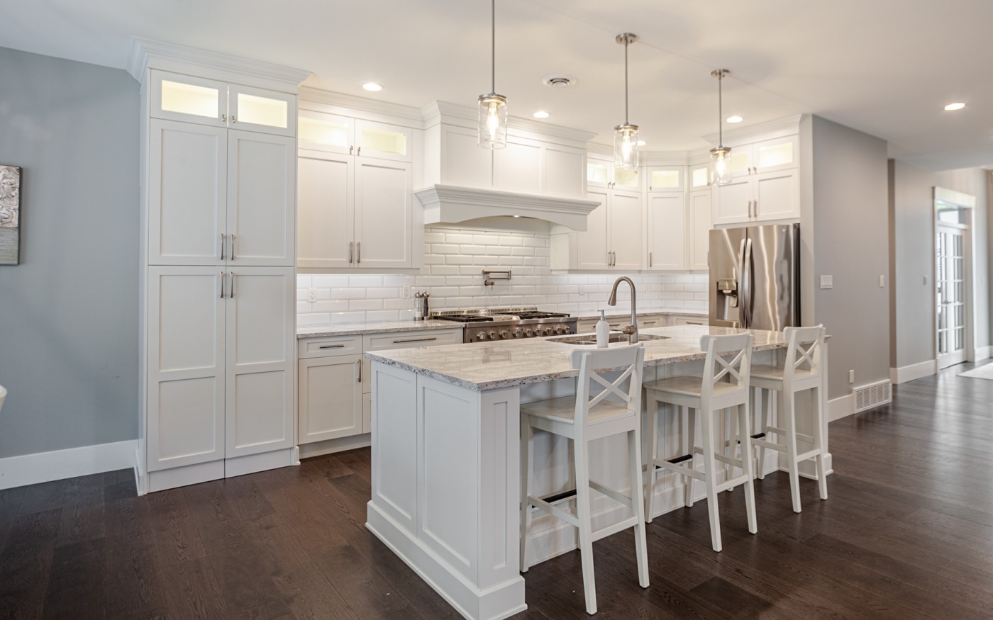 L-shaped kitchen layout with open concept design and natural light