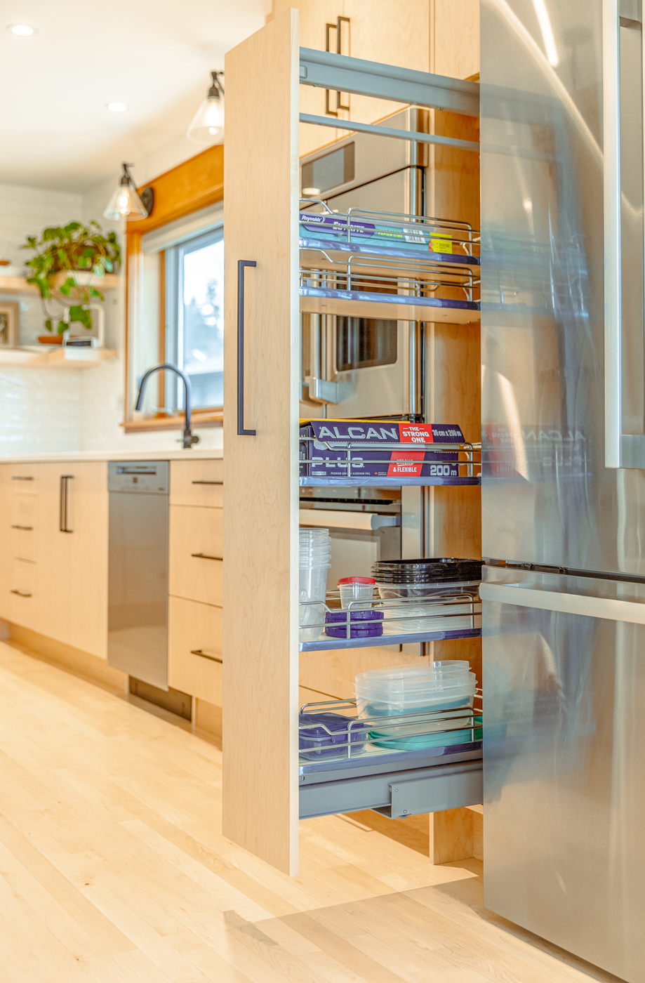 Hidden kitchen storage and custom cabinet organization